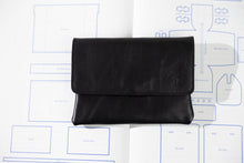 Load image into Gallery viewer, Black leather wallet on a white background with blue lines